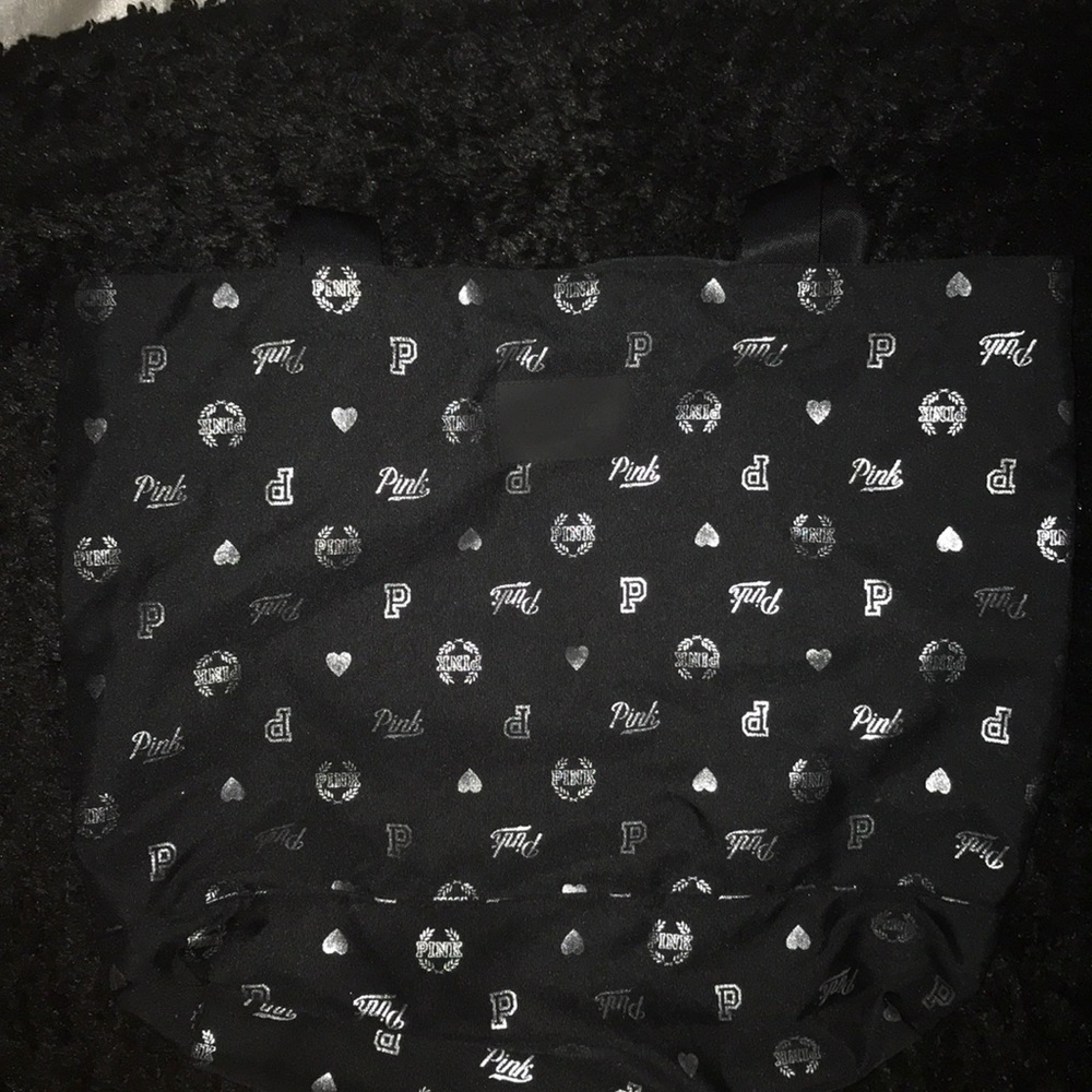 An all black Victoria’s Secret extra large tote